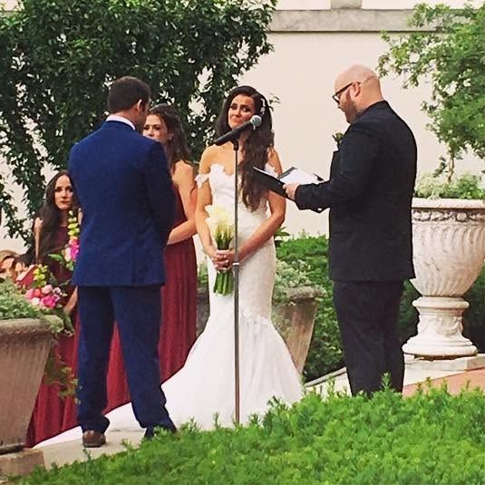 Rob and Kristen exchanging vows in the garden at The War Memorial
