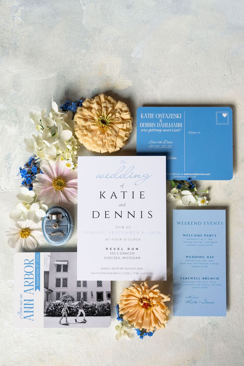 Katie and Dennis’s invitation suite with peach dahlias and blue flowers
