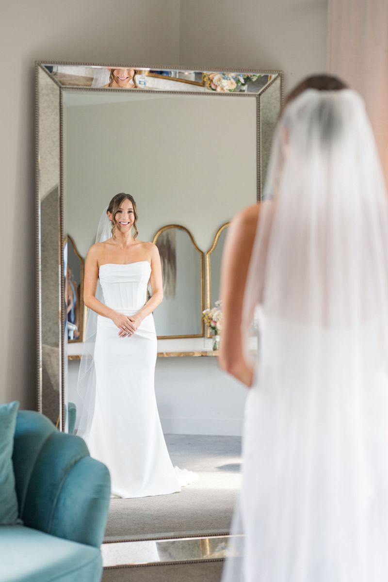 Katie in her veil at the mirror