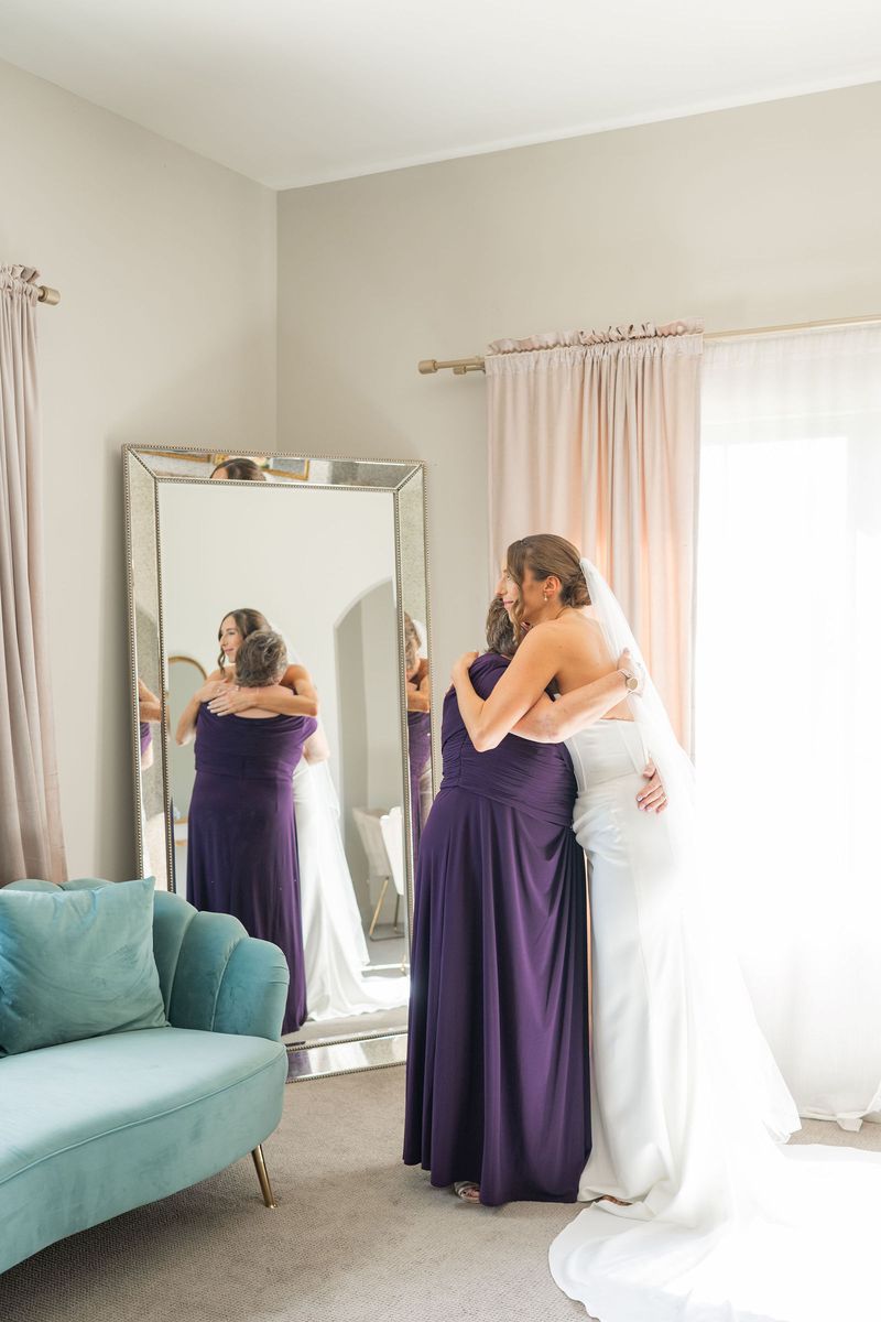 Katie hugging her mother at the mirror