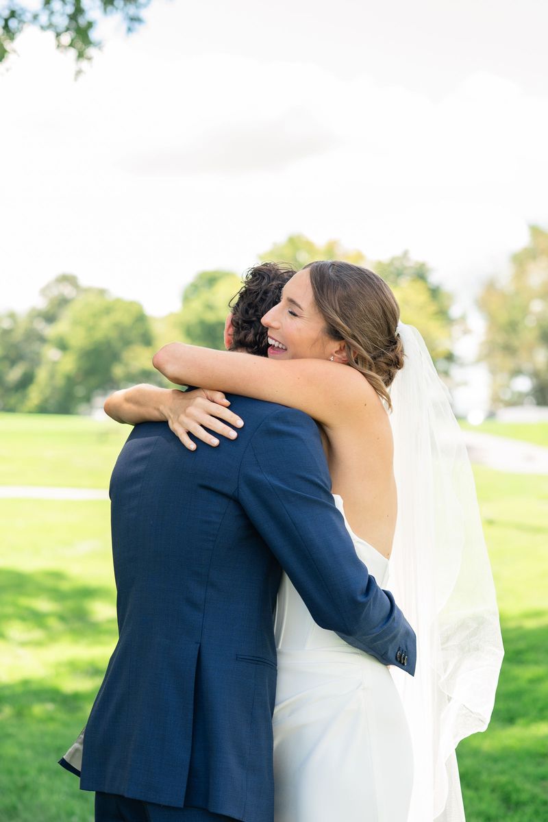 Katie and Dennis embracing at their first look