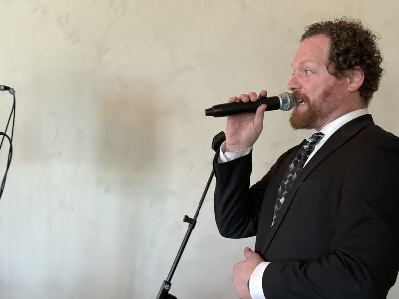 Dave Menzo on the microphone at Katie and Dennis’s reception