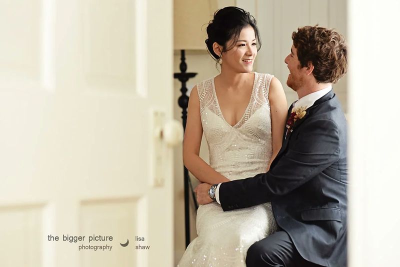 Brian and Yu-ju by a window
