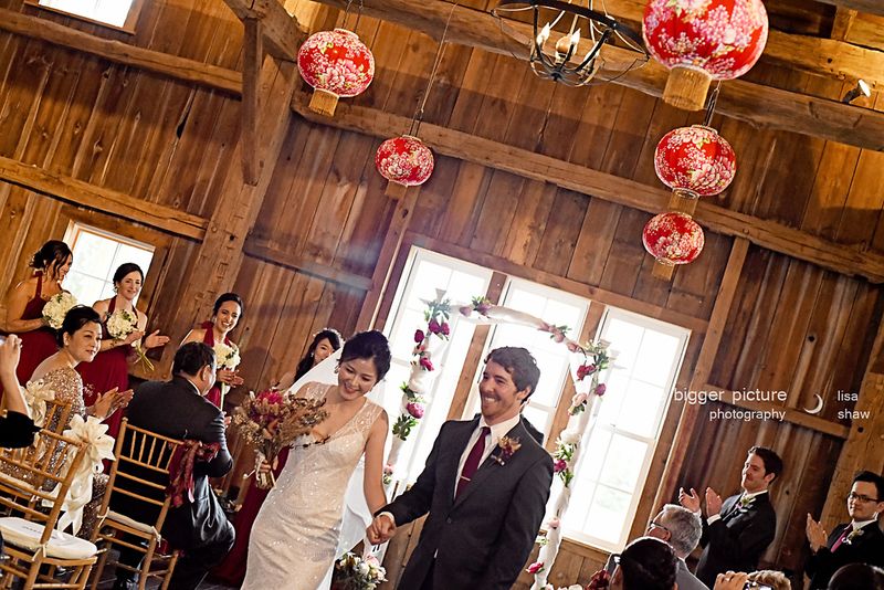 Brian and Yu-ju walking back up the aisle to applause