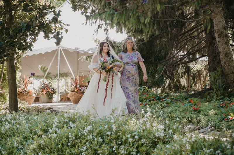 Heather walking down the garden aisle