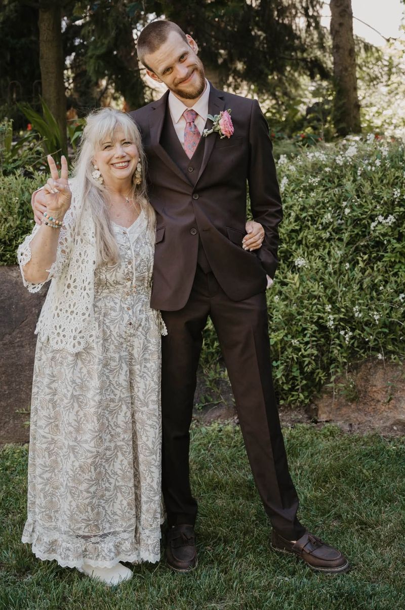 Tyler with a guest flashing a peace sign