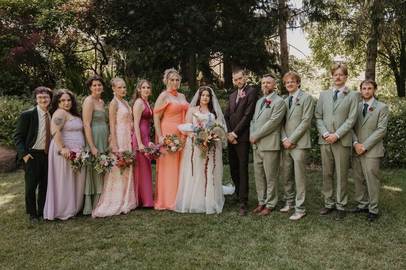 The whole wedding party in the garden