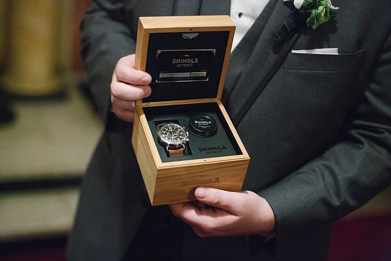 Bryan holding a watch box, a wedding-morning gift