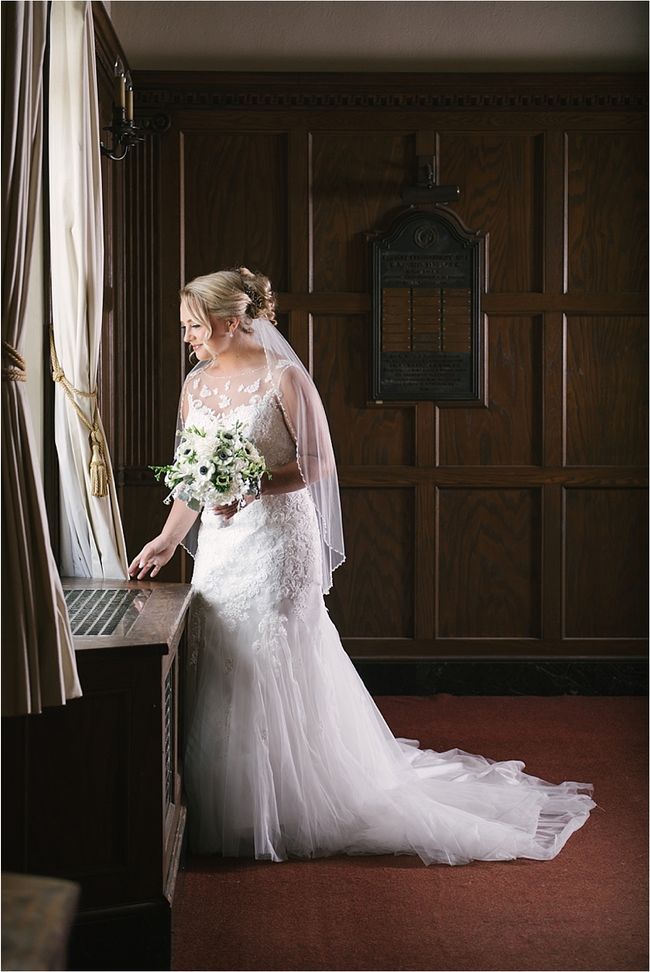 Patricia at a tall window in her gown