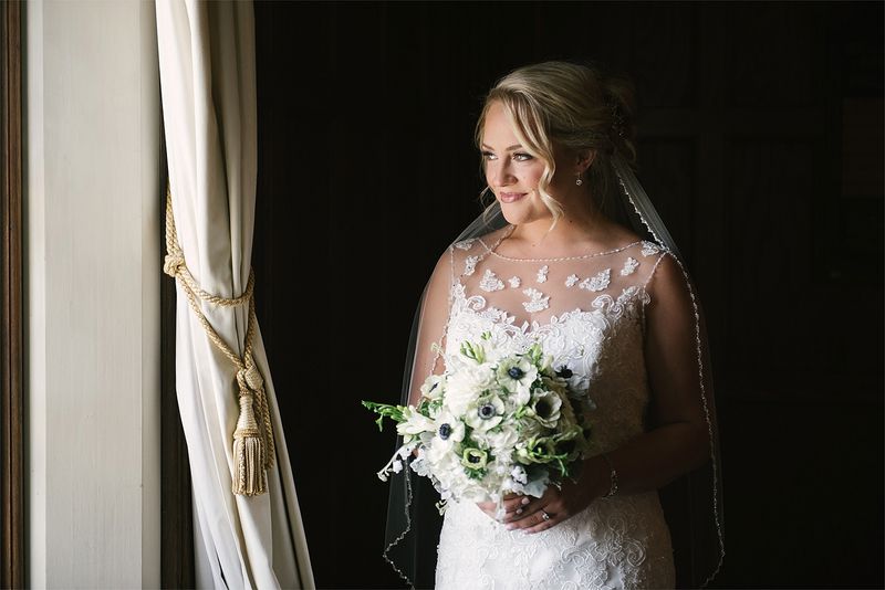 Patricia by a window, light on her veil