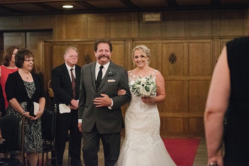 Patricia walking down the aisle with her father