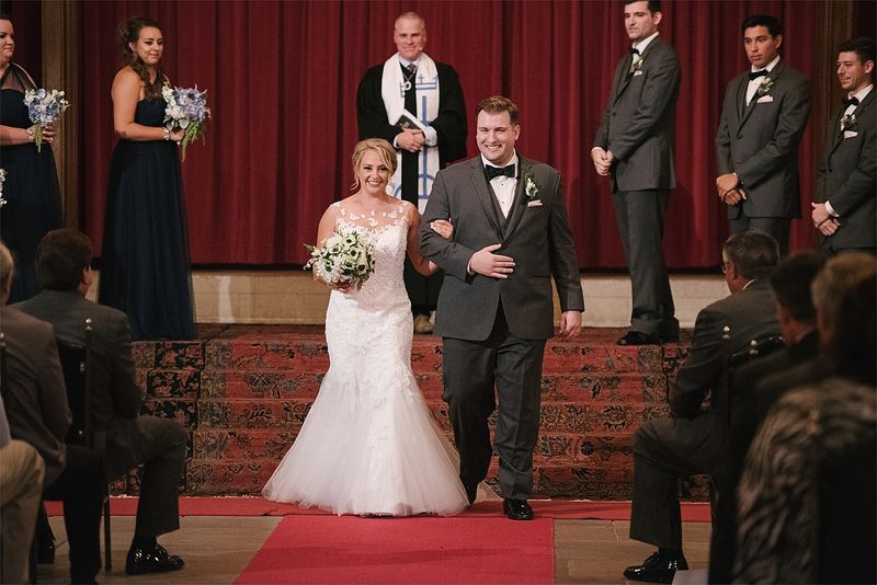 Patricia and Bryan walking back up the aisle